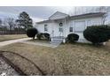Traditional home with tidy lawn and a cozy, covered entrance at 528 Mill St, Smithfield, NC 27577