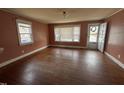 Inviting living room featuring gleaming hardwood floors and a front door at 528 Mill St, Smithfield, NC 27577