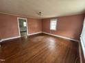 Spacious living room boasting hardwood floors and large windows for natural light at 528 Mill St, Smithfield, NC 27577