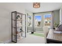 Well-lit home office with a modern bookshelf, providing a functional workspace at 605 Leland Hl Cir, Zebulon, NC 27597