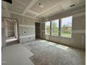 Bedroom bathed in natural light with large windows offering serene views at 63 Daybreak Way, Fuquay Varina, NC 27526