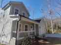 Two-story home featuring a covered porch, and a spacious driveway leading to a two-car garage at 632 Angus Ct, Sanford, NC 27332