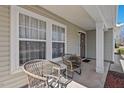 Cozy covered front porch with seating, creating an inviting outdoor space at 634 Conover Rd, Durham, NC 27703