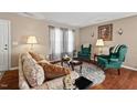 Comfortable living room featuring stylish decor, hardwood floors, and ample seating space at 634 Conover Rd, Durham, NC 27703