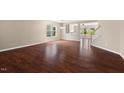 Bright living room with gleaming hardwood floors and abundant natural light at 634 Conover Rd, Durham, NC 27703