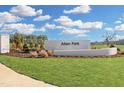 Allen Park entrance sign with lush green lawn and landscaping against a bright blue, partly cloudy sky at 928 Allen Park Dr, Knightdale, NC 27604
