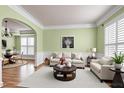 Cozy living room with plush seating, decorative accents, and ample natural light at 100 Burlingame Way, Cary, NC 27513