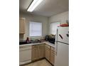 Another view of the kitchen featuring white appliances and ample counter space for meal preparation at 2002 Technology Woods Drive # 103, Raleigh, NC 27603