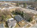 Aerial view of a home with a cozy front porch, swing, and well-kept yard at 202 W Hill St, Benson, NC 27504