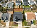Aerial view of a home with a dark roof in a neighborhood with fenced yards at 2344 Lazy River Dr, Raleigh, NC 27610