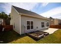 Spacious backyard featuring a concrete patio and garden beds at 2344 Lazy River Dr, Raleigh, NC 27610