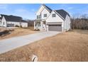 Charming two-story home with a long driveway at 285 Scotland Dr, Youngsville, NC 27596