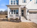 Charming front porch with stylish stone accents at 285 Scotland Dr, Youngsville, NC 27596