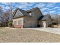 Attached three-car garage offering ample parking space with easy access to the home at 5439 Cokesbury Rd, Fuquay Varina, NC 27526