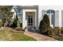 Inviting front entrance featuring a brick pathway and an elegant glass paneled front door at 809 Wayne Dr, Raleigh, NC 27608