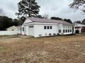Charming single-story home with attached garage, light-colored siding and a well-maintained lawn at 102 Sue Ave, Dunn, NC 28334