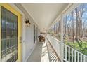 Inviting front porch with seating offers a relaxing outdoor space at 11424 Horsemans Trl, Raleigh, NC 27613
