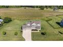 Expansive aerial view of a traditional home with well-maintained landscaping and a large yard at 124 Brookstone Way, Angier, NC 27501