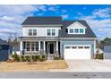Charming two-story home with a two-car garage and craftsman-style details at 124 Ferrell W Rd, Apex, NC 27523