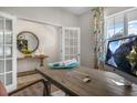 Bright home office featuring french doors, and a modern desk setup perfect for productivity at 176 Ethel Ln, Angier, NC 27501