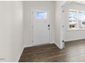 Bright entryway featuring a white door with glass, wood floors, and neutral paint at 281 Hanging Elm Ln, Fuquay Varina, NC 27526
