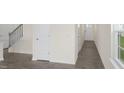 Inviting entryway with modern flooring, neutral walls, and a staircase leading to the upper level at 292 Perseus St, Angier, NC 27501