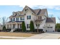 Elegant two-story house boasts black shutters, attached garage, and carefully manicured landscaping at 5025 Fanyon Way, Raleigh, NC 27612