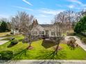 Lovely home with mature landscaping and pristine lawn at 1212 Red Brick Rd, Garner, NC 27529