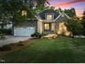Charming stone home with a well-manicured lawn and attached garage, perfect for a Gathering seeking comfort and style at 1315 Sagamore Dr, Louisburg, NC 27549