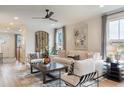 Cozy living room with a white sofa, stylish chairs, modern decor, and plenty of natural light at 320 Catheys Crk Cir, Wendell, NC 27591