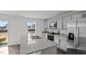 Modern kitchen with stainless steel appliances and granite countertops and an island at 405 Citron St, Sanford, NC 27332