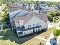 Beautiful townhome featuring well-maintained lawn, back porch, and charming architectural details at 4137 Strendal Dr, Cary, NC 27519