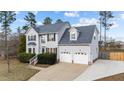 Charming two-story home with an attached two-car garage and beautiful landscaping at 415 Moonlight Dr, Fuquay Varina, NC 27526