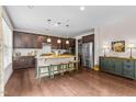 Modern kitchen featuring dark wood cabinets, granite countertops, and stainless steel appliances at 428 Morgan Ridge Rd, Holly Springs, NC 27540