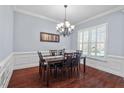 Dining area with hardwood floors, chandelier and natural light at 4711 Marena Pl, Durham, NC 27707