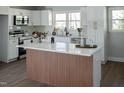 Modern kitchen with stainless steel appliances and a marble-topped island at 5845 Farmwell Road Rd, Raleigh, NC 27610