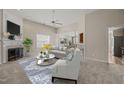 Bright and airy living room featuring a fireplace, neutral color palette, and an open floor plan at 7 Windsor Glen Dr, Durham, NC 27703