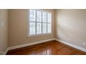 Bright room with hardwood floors and a window with white shutters at 804 Long Meadows Rd, Chapel Hill, NC 27516