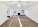 Spacious living room with plush carpeting, fireplace, and plenty of natural light at 8425 Fawncrest Dr, Raleigh, NC 27603
