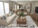 Bright living room with plush sofa, stylish decor, and an open layout at 9115 Nc 157, Rougemont, NC 27572