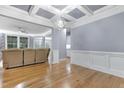 Spacious living room featuring hardwood floors, neutral walls, and an open layout at 104 Red Bark Ct, Apex, NC 27539