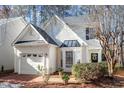 Inviting home with a brick driveway and a manicured front yard landscape at 1208 Copper Creek Dr, Durham, NC 27713