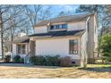 Charming two-story home with light siding, dark trim, and landscaped front yard at 1615 Old Barn Rd, Rocky Mount, NC 27804