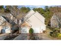 Charming home featuring a two-car garage and a combination of stone and vinyl siding at 209 Intern Way, Durham, NC 27713