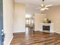 Inviting living room with fireplace, high ceiling, and stylish wood-look flooring at 212 Walnut Creek Dr, Clayton, NC 27520
