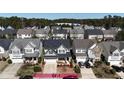 Suburban neighborhood featuring well-maintained homes with landscaped yards and mature trees at 2132 Royal Berry Ct, Cary, NC 27511