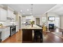 Modern kitchen with stainless steel appliances, a large center island, and an open layout at 2851 Wilkes Lake Dr, Fuquay Varina, NC 27526