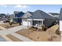 Beautiful view of the home's exterior, showcasing its landscaped yard and suburban setting at 2907 Jakes View Pt, Fuquay Varina, NC 27526