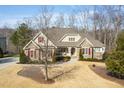 Beautiful home with mature trees surrounding the property at 363 Rolling Meadows Ln, Chapel Hill, NC 27517