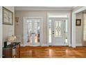 Inviting foyer boasts gleaming hardwood floors and a beautifully designed front door at 363 Rolling Meadows Ln, Chapel Hill, NC 27517
